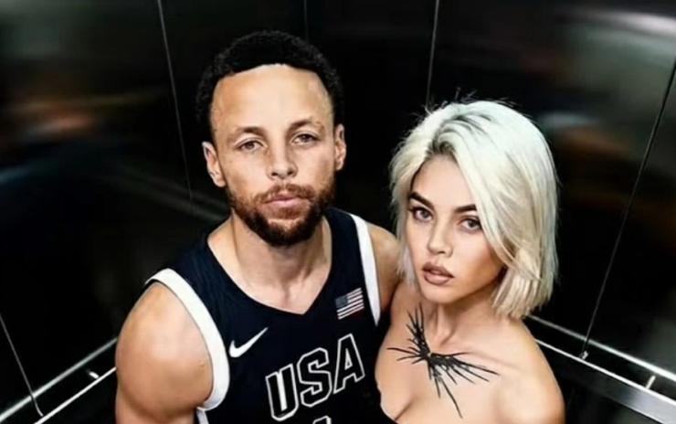 Stephen Curry in ascensore con una ragazza bionda